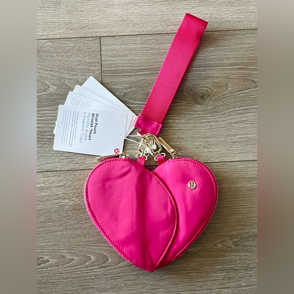 lululemon athletica Handbags - NWT Lululemon Dual Pouch Heart Wristlet in Hot Pink. SOLD Out Online